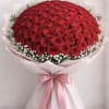 A breathtaking bouquet of 100 fresh red roses, beautifully hand-tied and wrapped