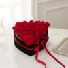 A heart-shaped black Velvet box with Roses and Spray roses.
Flowers colors can