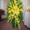 Yellow standing spray with flowers, a beautiful tribute for a loved one's