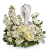 As serene as gentle falling snow, this pure white arrangement of roses