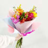 A beautiful bouquet with seasonal bright and lovely colors wrapped in our