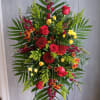 Featuring a thoughtful blend of red and yellow flowers, this arrangement conveys