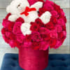 All around roses of any color arranged in box (stuffed bear included)
