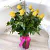 Flowers and More classic dozen roses arranged in a clear glass vase