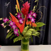 **Tropicals will vary**
Vibrant tropical florals designed tall with a sleek modern twist