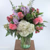 This enchanting bouquet features an exquisite combination of pink roses, white hydrangeas