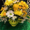 in a yellow and white daisies with yellow roses and spray roses