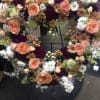 Peach roses and white stock in heart shape for standing spray
