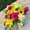 yellow lily, lisianthus, and sunflower, pin and red Gerbera daisies with white