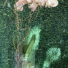 Tall clear glass vase with orchidaceae. Vase may be round or square.