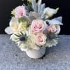 Radiant Beauty is a full arrangement featuring orchids, lilies, hydrangeas, roses, and
