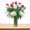 Arrangement made of one dozen of red and pink roses and white