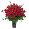 Three dozen premium roses designed with specialty foliage in a clear vase.

Approximately
