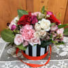A unique spin on the classic Valentine's Day arrangement. Fresh flowers beautifully