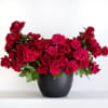 A lavish expression of passion, this lush arrangement of premium red roses