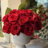 Modern two dozen roses In a beautiful ceramic container