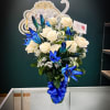 This stunning vase arrangement comes with blue long stem lillies and 24