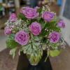 A traditional dozen roses, designed in an hourglass vase. Customize your dozen