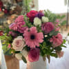 Vibrant pinks, roses, seasonal fillers and pretty greenery. 