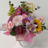Delight someone special with our Pastel Garden Arrangement, a breathtaking blend of