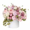 A soft, romantic floral arrangement designed in a refined palette of blush