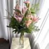 Sweet lilies, pink stock in a tall slender vase. Such a lovely
