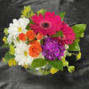 European style arrangement with a mix of Summer colors.