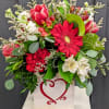 A Beautiful Wooden Box Filled with Seasonal Blooms In Valentine's Day Colors.