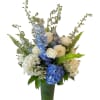 Hydrangeas, dahlias, blue delphinium, roses, fern and more designed in a tall
