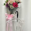 Brighten any day, come rain or shine, with this charming floral arrangement!