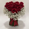 floral arrangement of 12 red roses, with details to enhance the color
