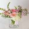 A soft, glowing harmony. Pastel Glow is a floral arrangement designed to