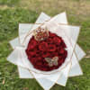 Bouquet of 50 red roses , decorated with a beautiful golden crown