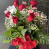 Bouquet style of 12 Red South American Roses arrange with greenery and