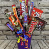 This delightful candy bouquet is a playful fusion of color and sweetness