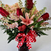 Red roses, pink lilys, stock - fragrant in sturdy, red glass vase