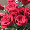 An elegant and classic long stem red roses bouquet in a tall