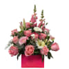 A rose arrangement in a clutch bag featuring 11 light pink roses
