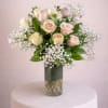 Graceful and romantic, this classic arrangement of a dozen pink roses conveys