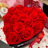 A heart-shaped box filled with red artificial roses, a timeless Valentine's gift