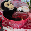 A charming &ldquo;Love You Always&rdquo; tub filled with artificial light pink roses