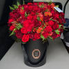 A beautiful romantic flower box arrangement filled with red burgundy premium flowers.