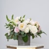 An elegant blend of lush peonies and garden blooms in soft coastal