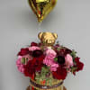 A stunning gold bear, heart and base filled with lush flowers- the