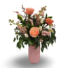 Key to My Heart is a romantic arrangement featuring soft peach roses