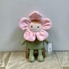 This plush doll is designed to look like a whimsical flower character.