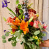 Designer's choice, bright and happy mixed flower bouquet. 
Container and basket available