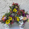 A sweet arrangement of a garden variety displayed in a mug as