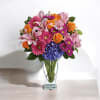 Featuring a wide, wondrous assortment of blooms in one bouquet, this colorful
