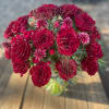 This arrangement will feature two dozen premium red heart ruffled roses with